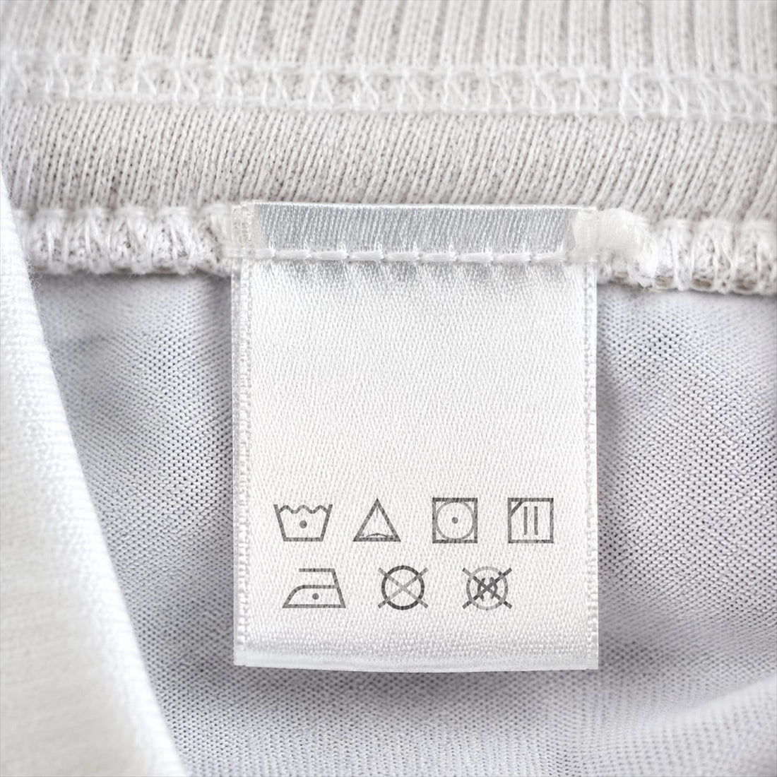 A vintage football shirt laid flat and measured
