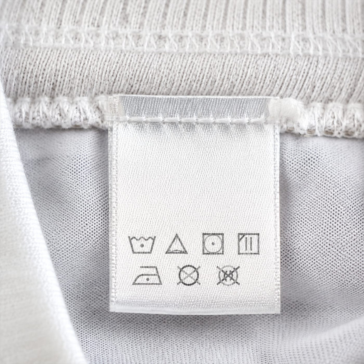 A vintage football shirt laid flat and measured