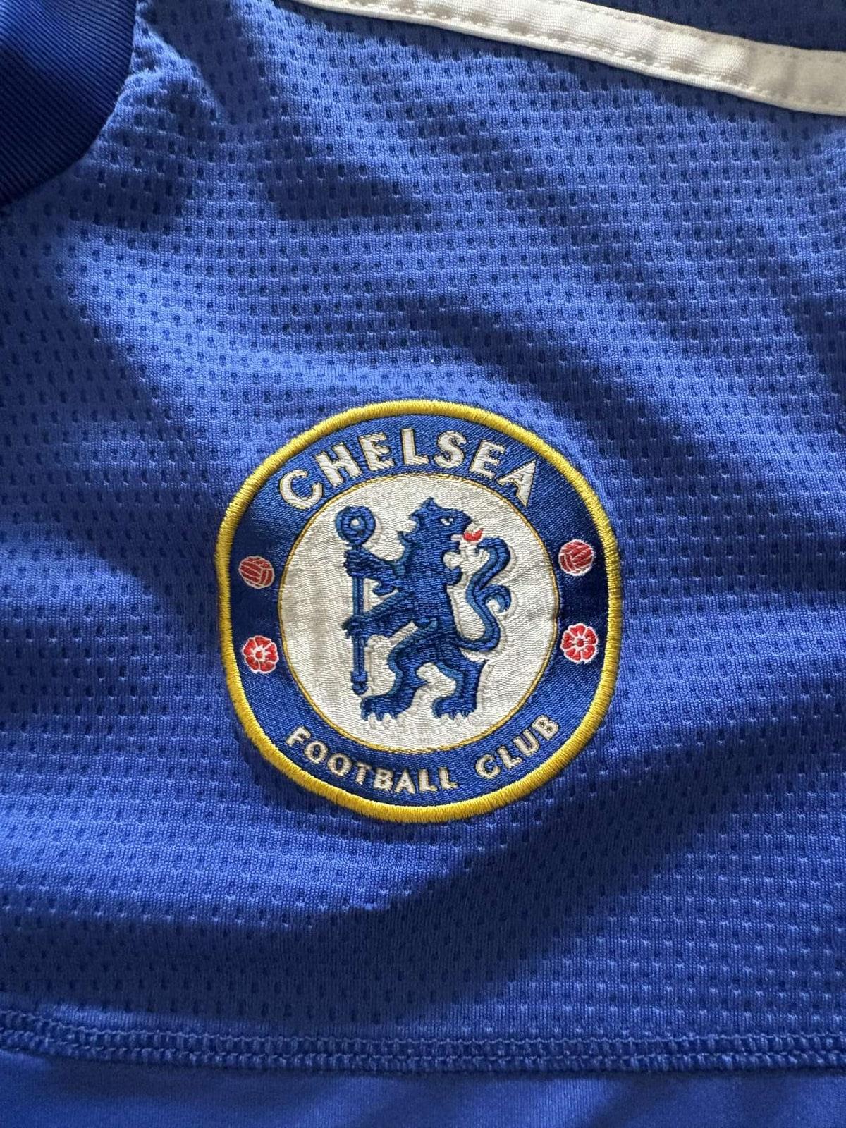 Embroidered Chelsea Football Club crest on the 2009/10 home shirt