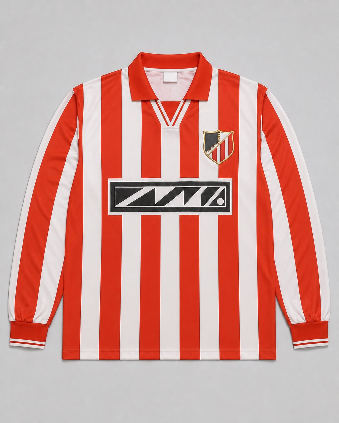 A modern reproduction football shirt with a flat printed crest and generic collar