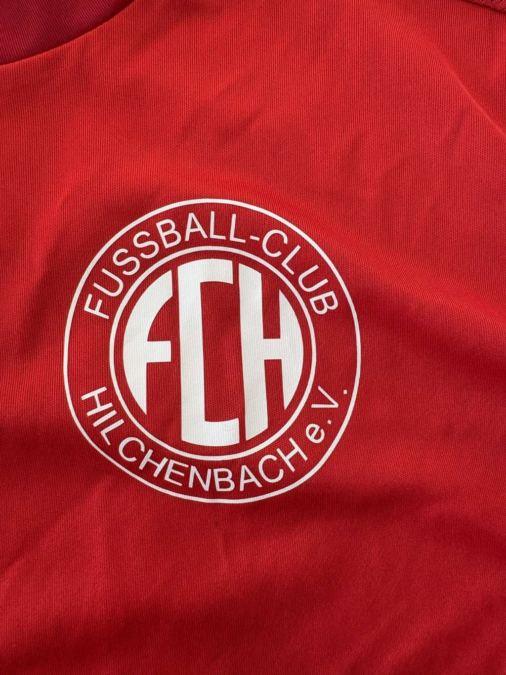 FC Hilchenbach club crest on the 2022/23 home shirt