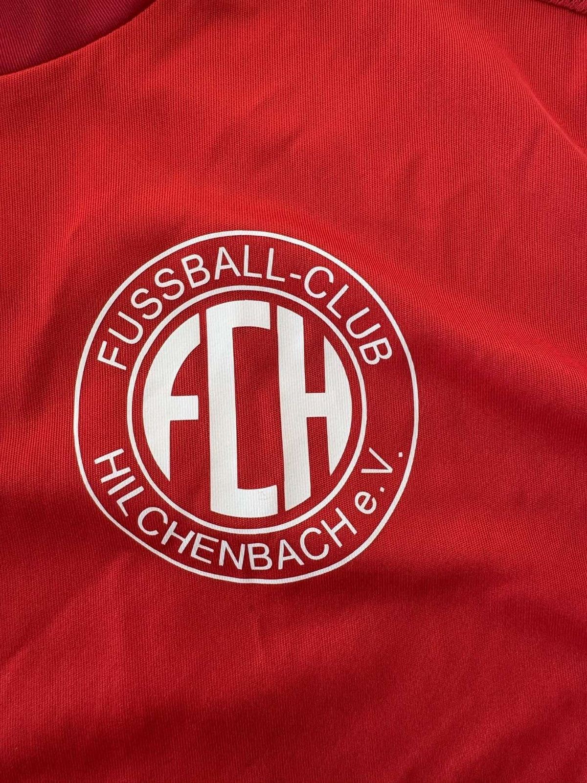 FC Hilchenbach club crest on the 2022/23 home shirt