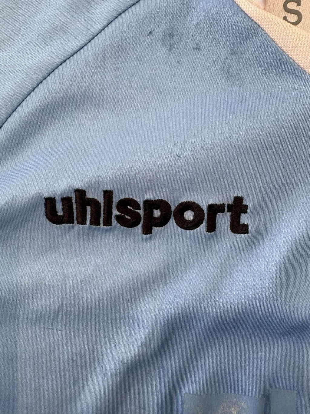 Uhlsport branding on the 2013/14 TSV 1860 Munich home shirt