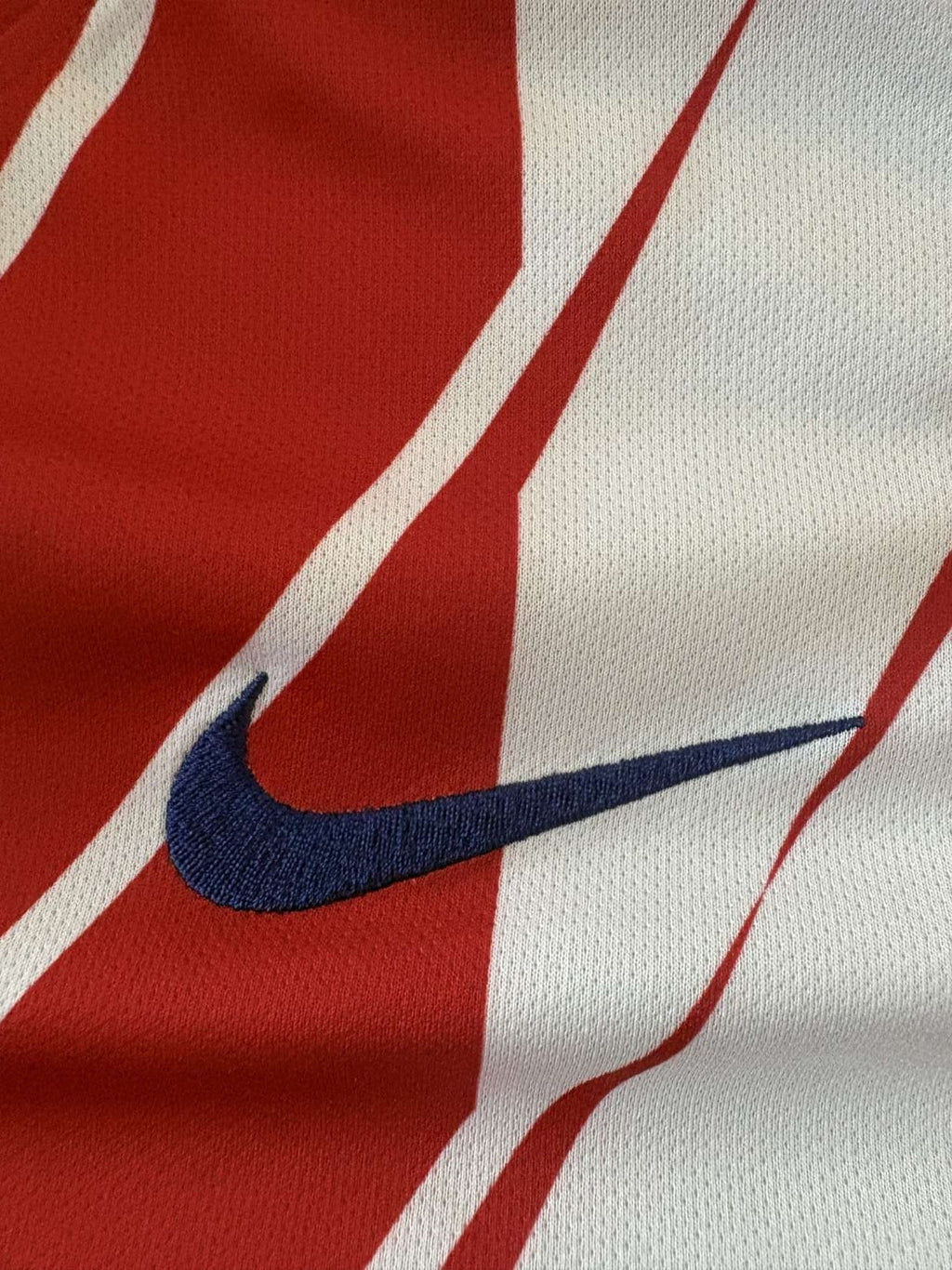 Nike branding on the 2017/18 Atlético Madrid home shirt