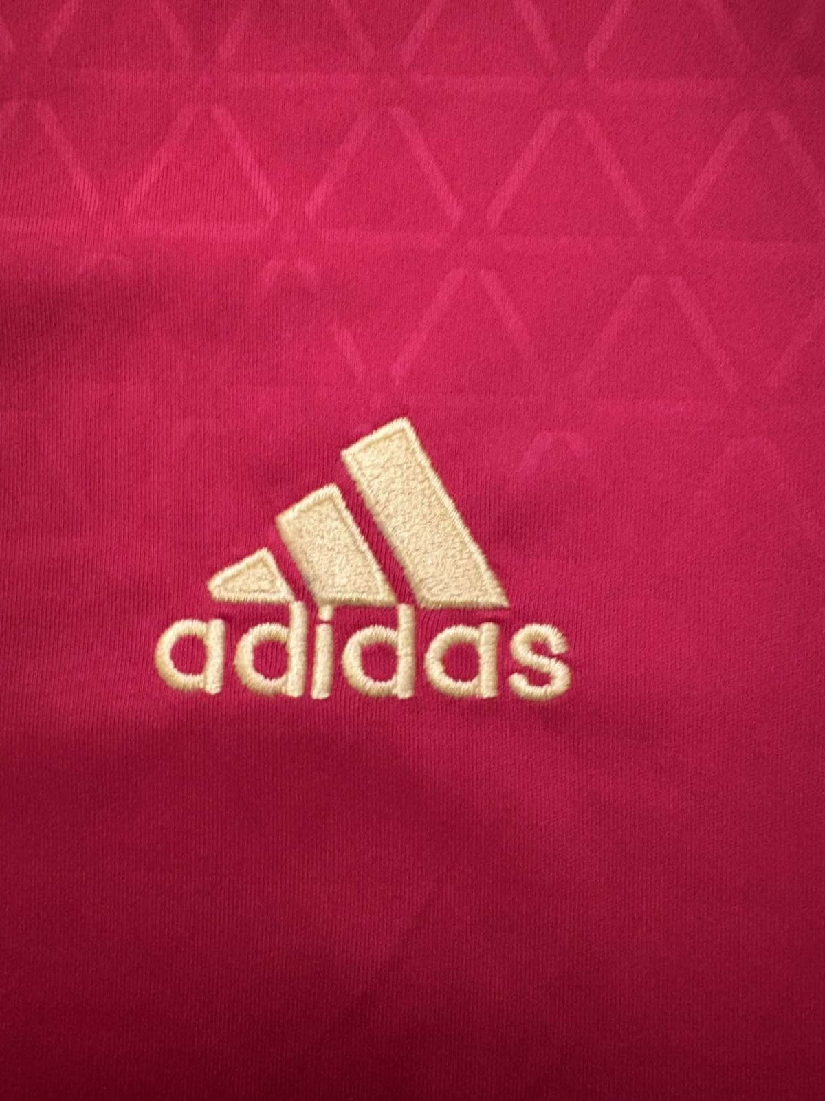 adidas logo on the 2016 Spain home shirt