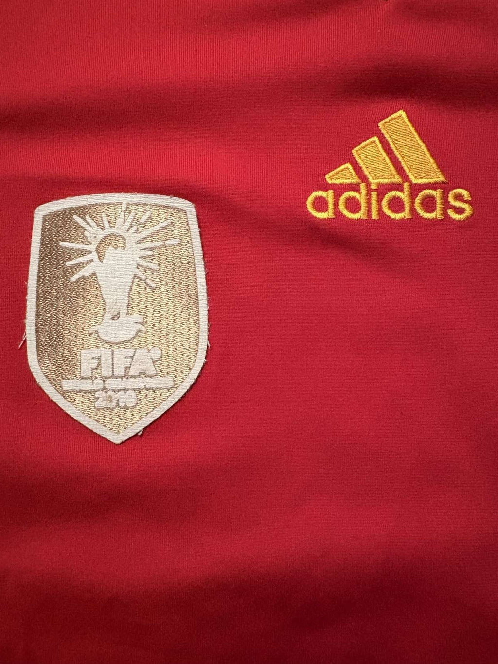 adidas logo on the 2010/11 Spain home shirt