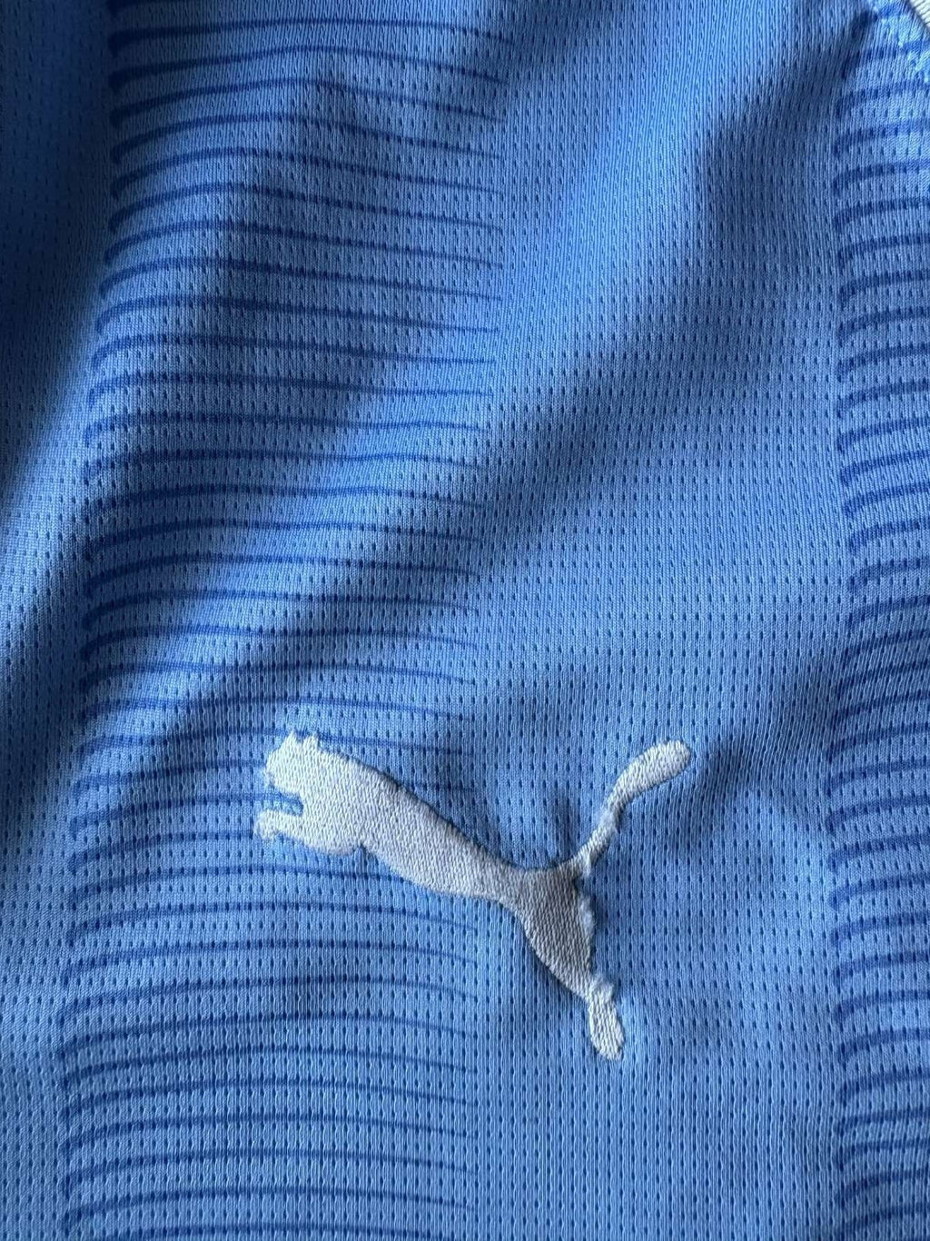 Puma logo on the 2023/24 Manchester City home shirt