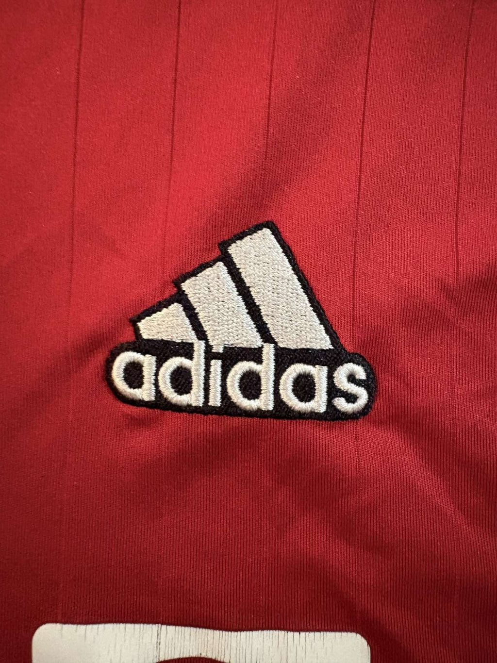 adidas branding on the 2022/23 Manchester United home shirt