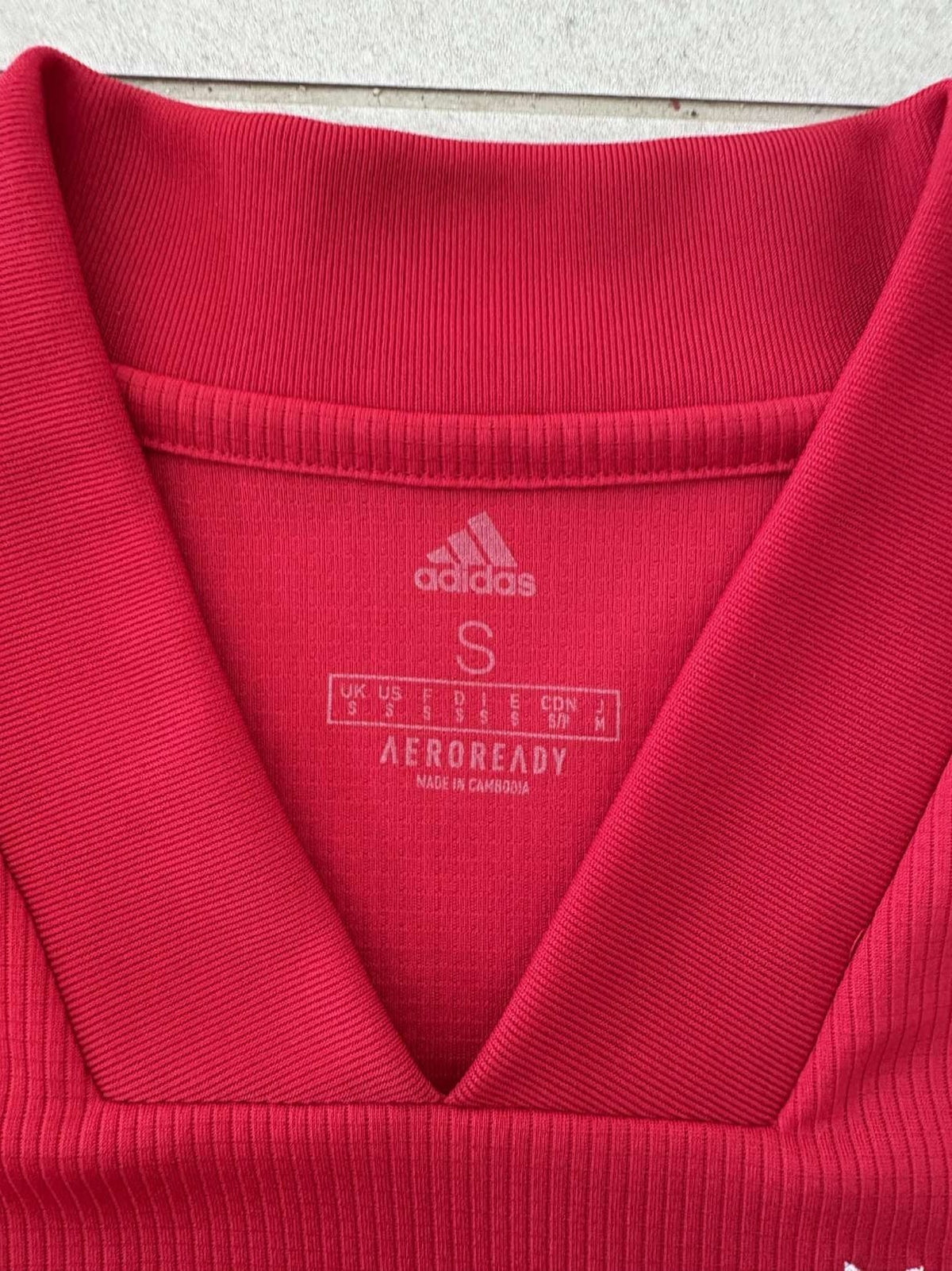 Neck and collar detail on the 2020/21 Ajax home shirt