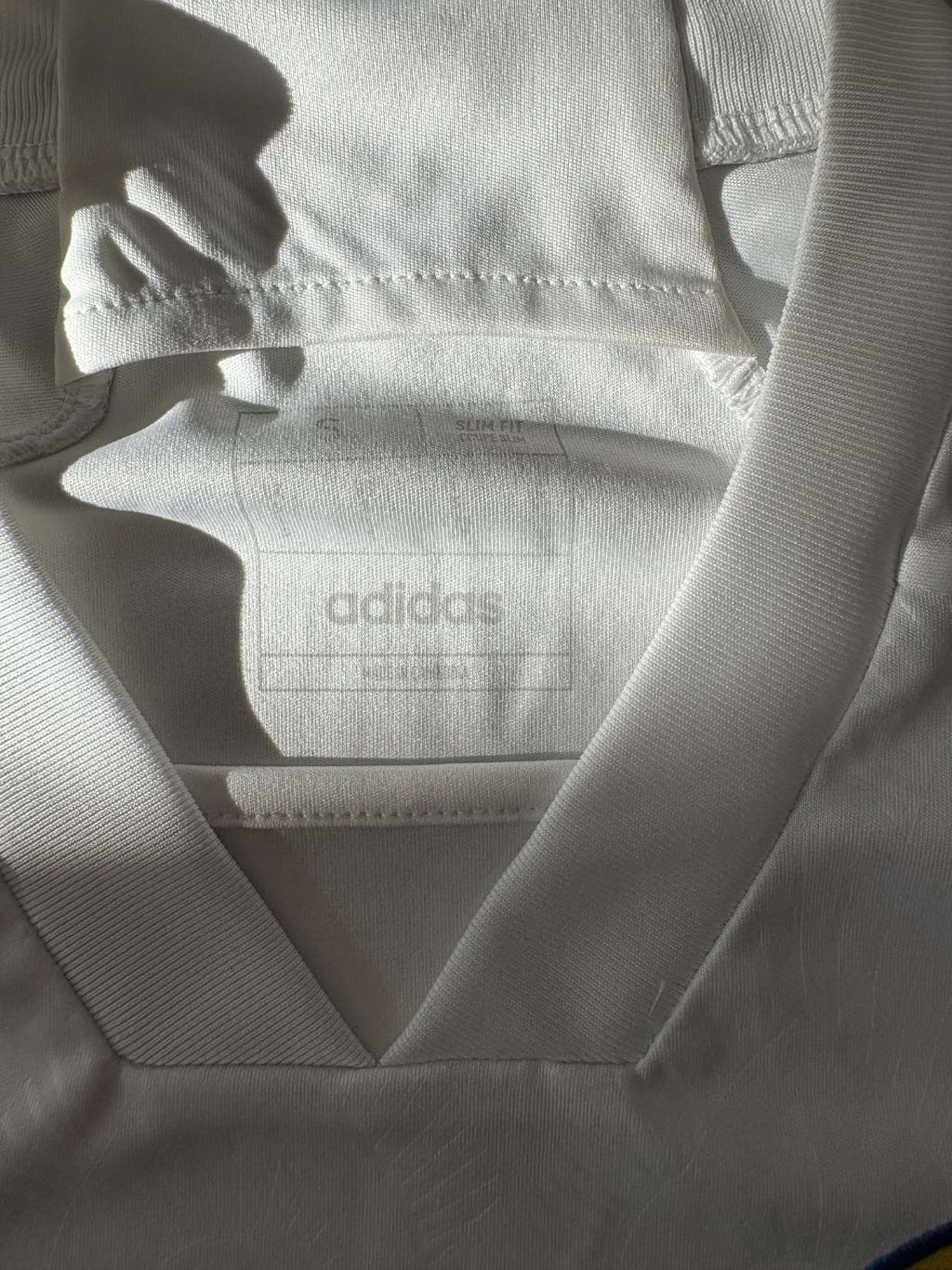 Neck and collar detail on the 2023/24 Leeds United home shirt