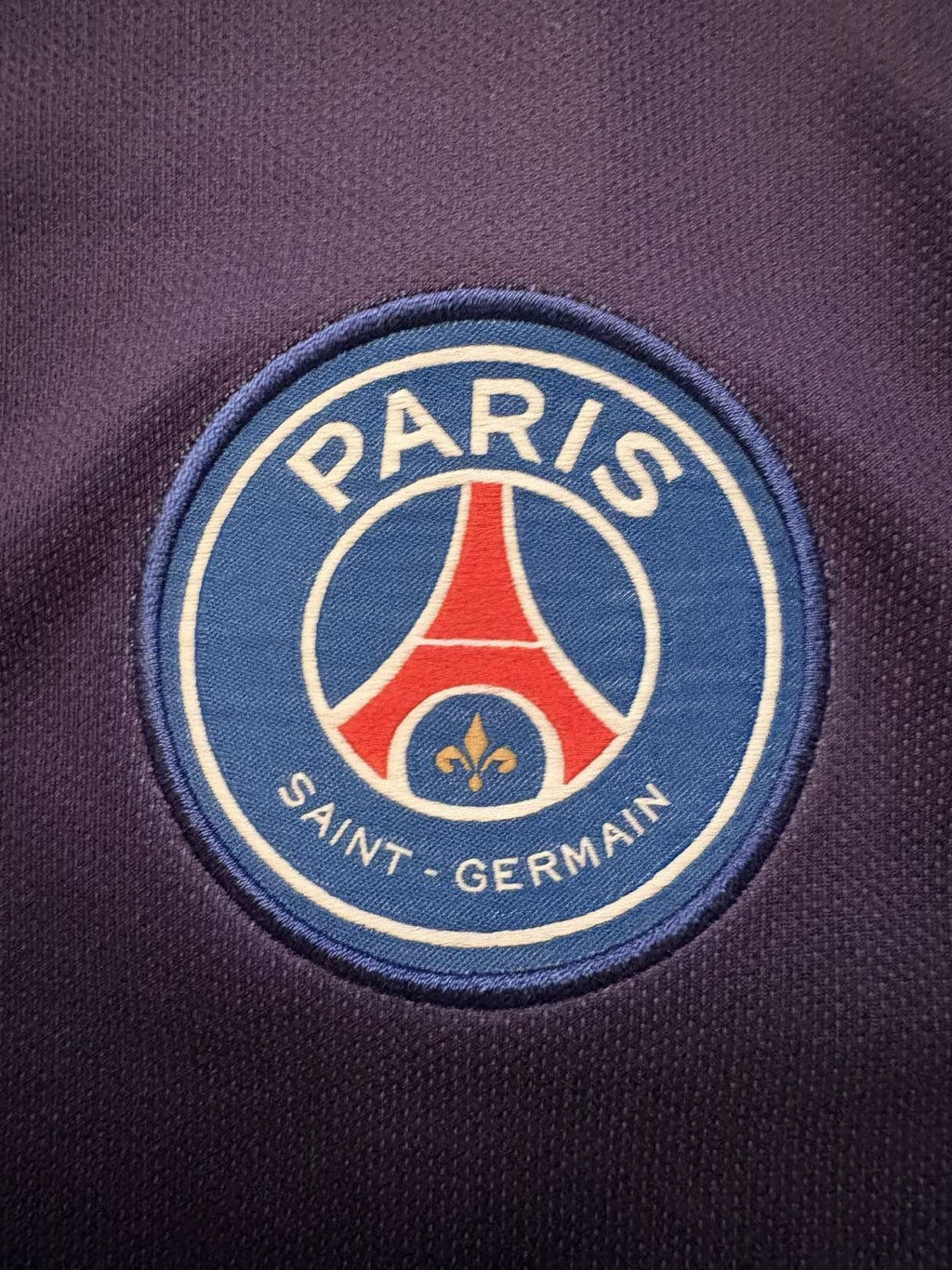 Paris Saint-Germain crest on the 2019/20 home shirt