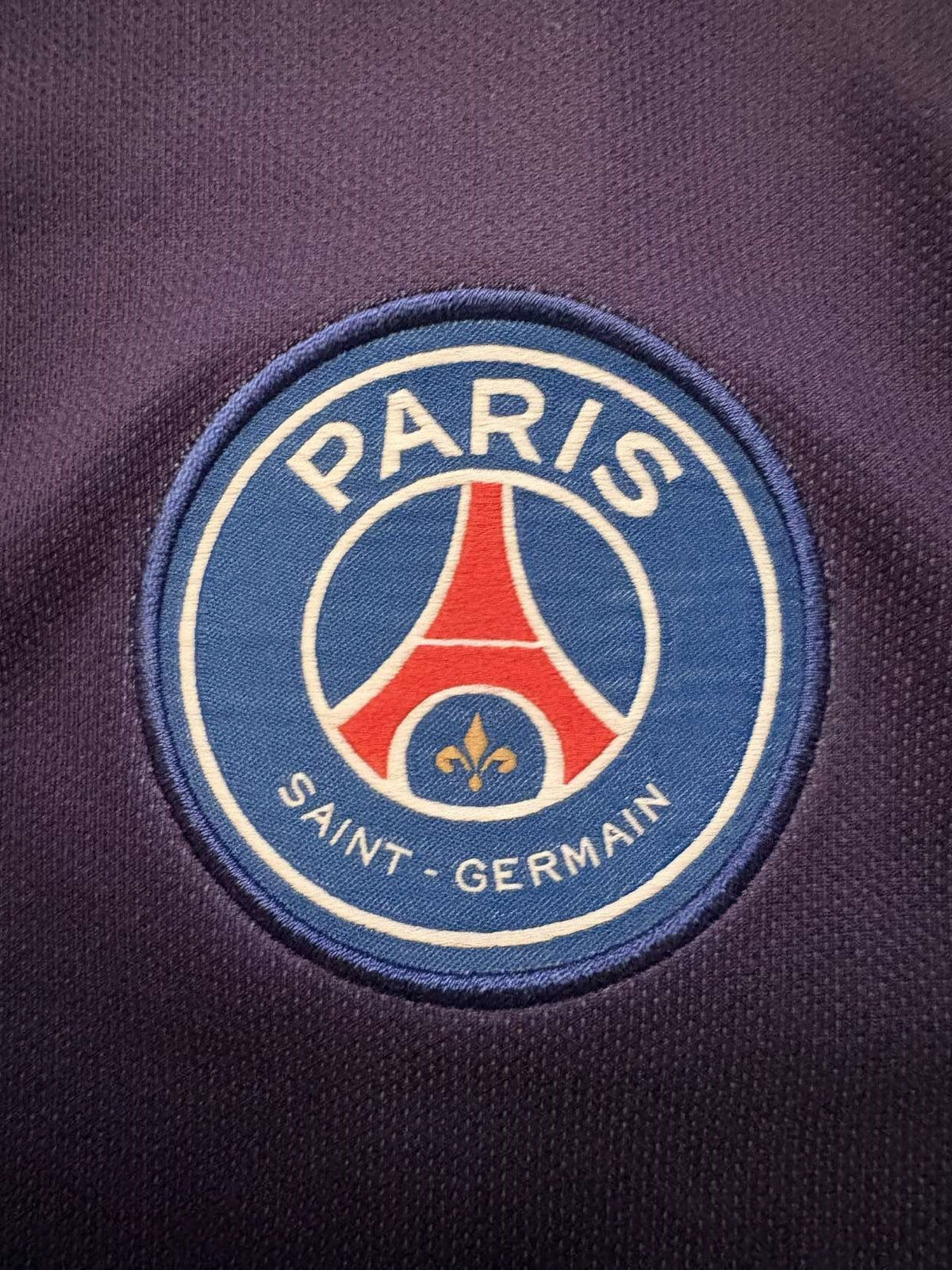 Paris Saint-Germain crest on the 2019/20 home shirt