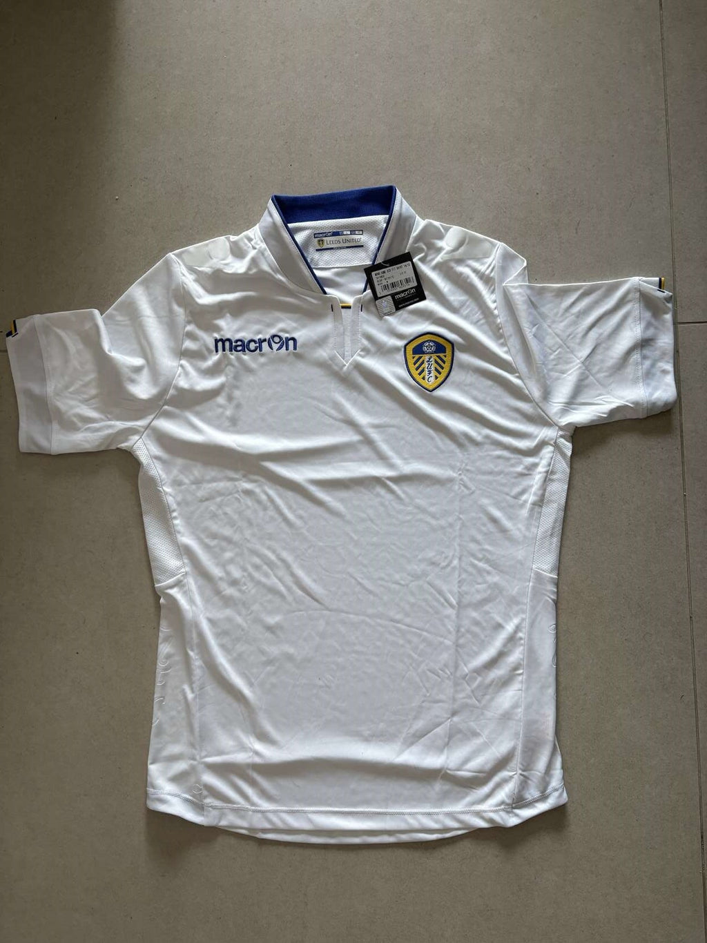 2014/15 Leeds United home shirt in white, front, Macron