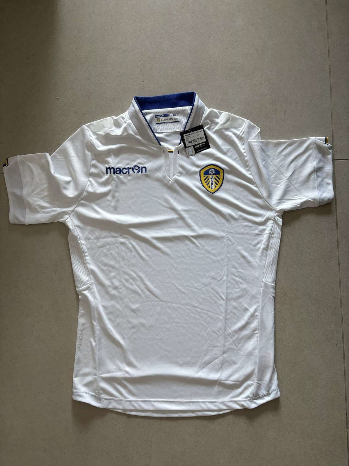 2014/15 Leeds United home shirt in white, front, Macron