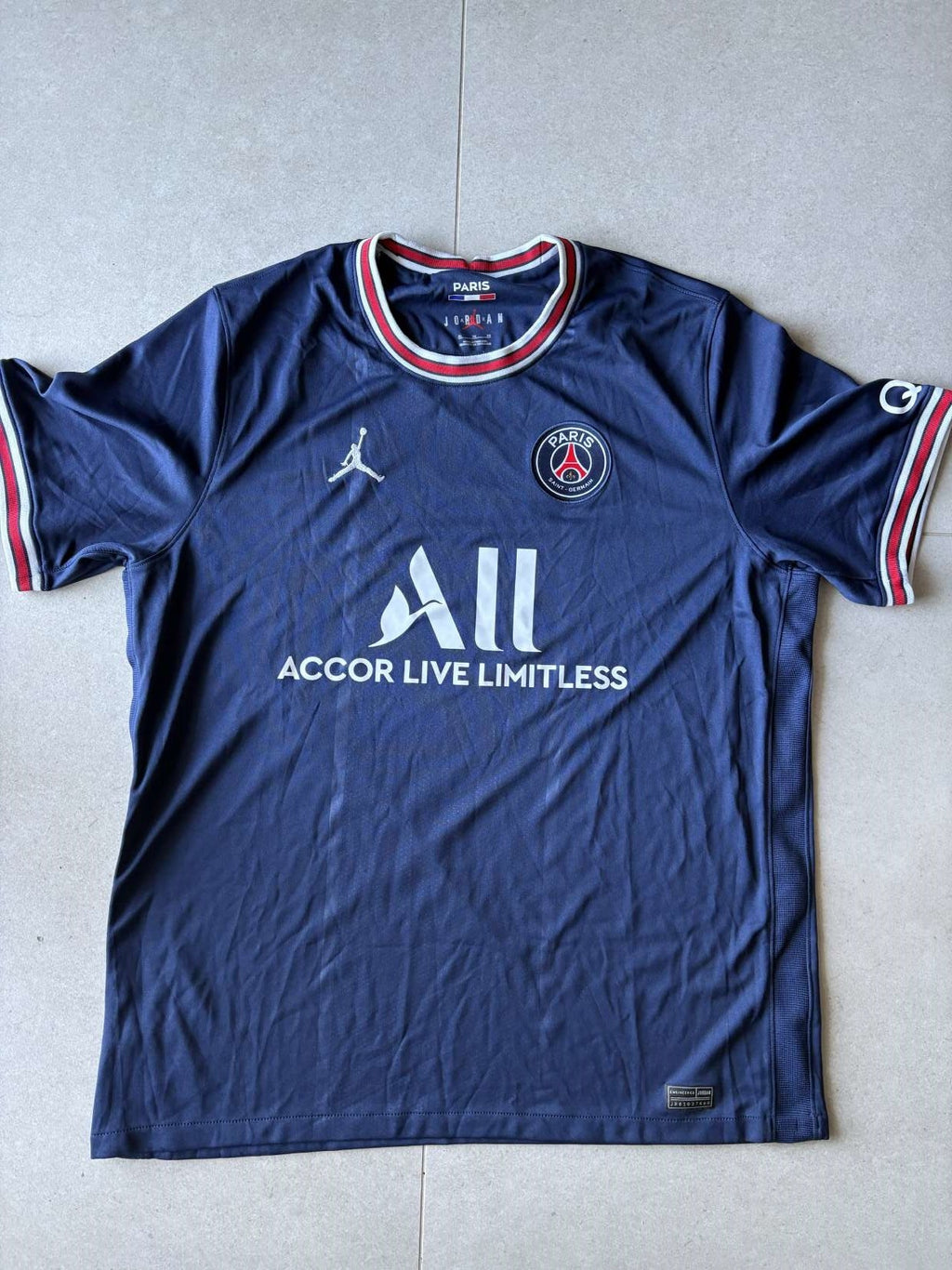 2021/22 Paris Saint-Germain home shirt in navy, front, Jordan