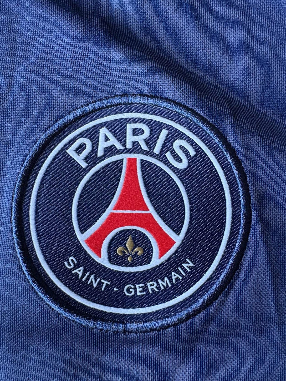 Paris Saint-Germain crest on the 2021/22 Paris Saint-Germain home shirt