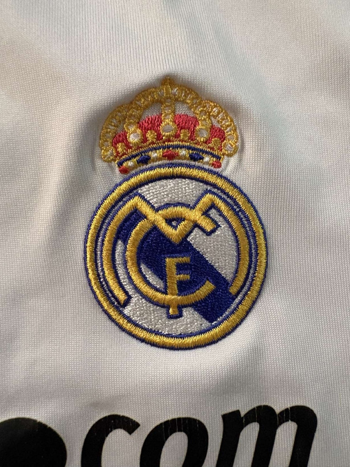 Real Madrid club crest on the 2009/10 home shirt