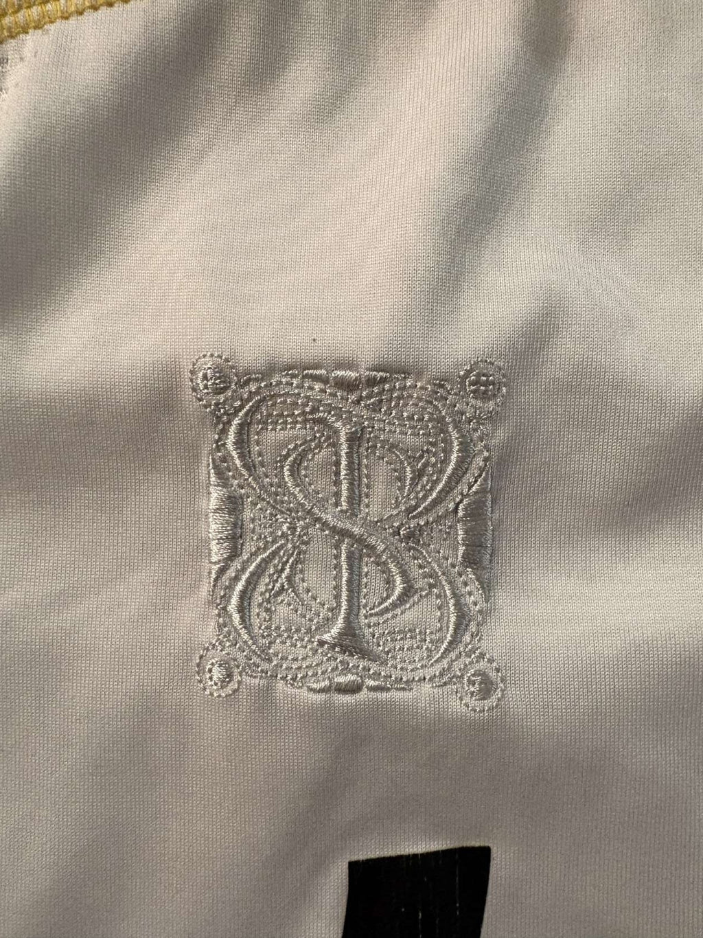 Special 2009/10 shirt emblem on the Real Madrid home shirt