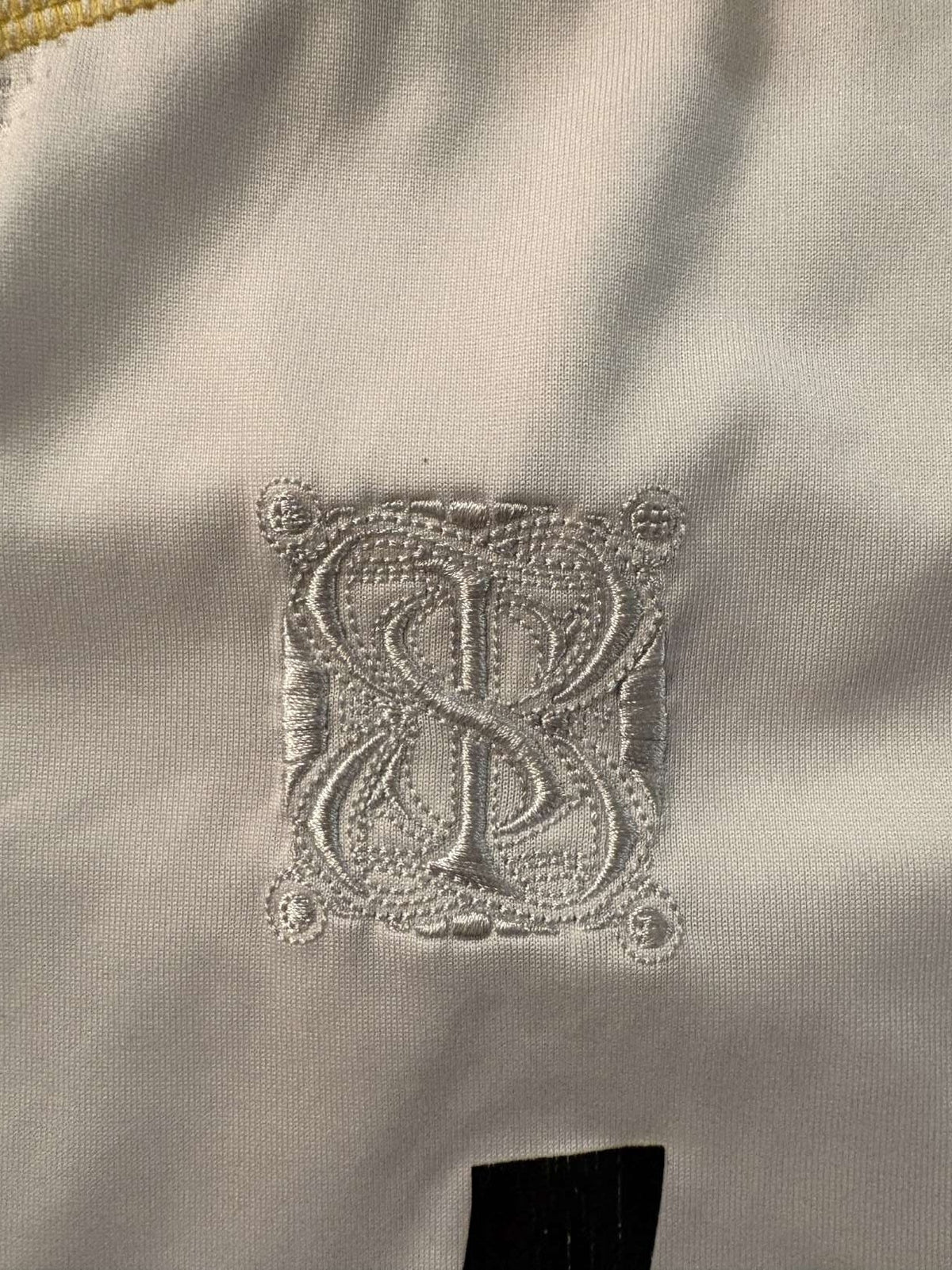 Special 2009/10 shirt emblem on the Real Madrid home shirt