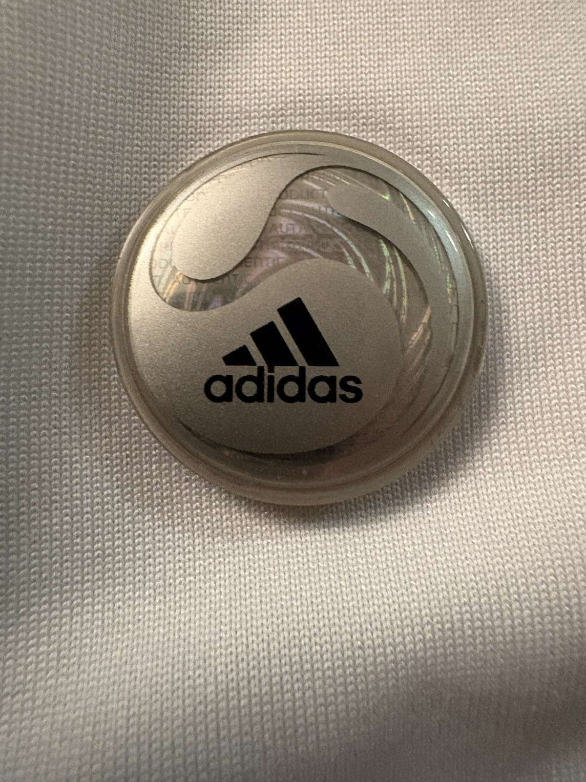 Embossed adidas manufacturer logo on the 2009/10 Real Madrid shirt