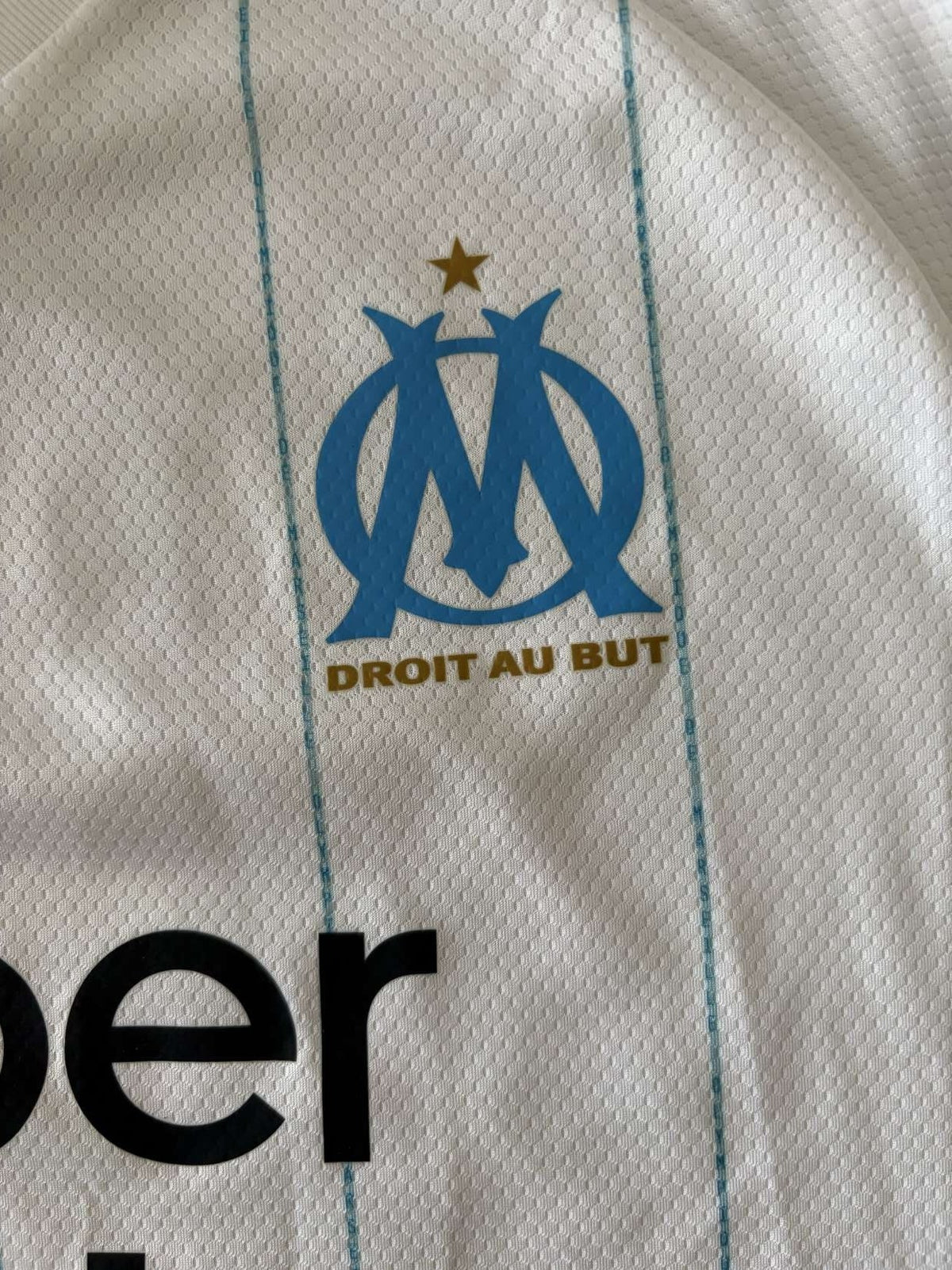 Marseille club crest on the 2019/20 home shirt