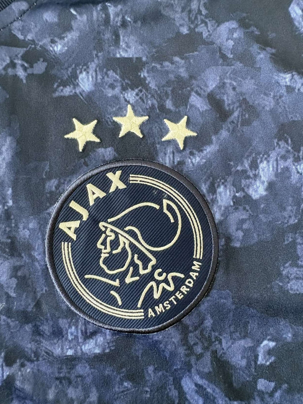 Ajax club crest on the 2017/18 away shirt