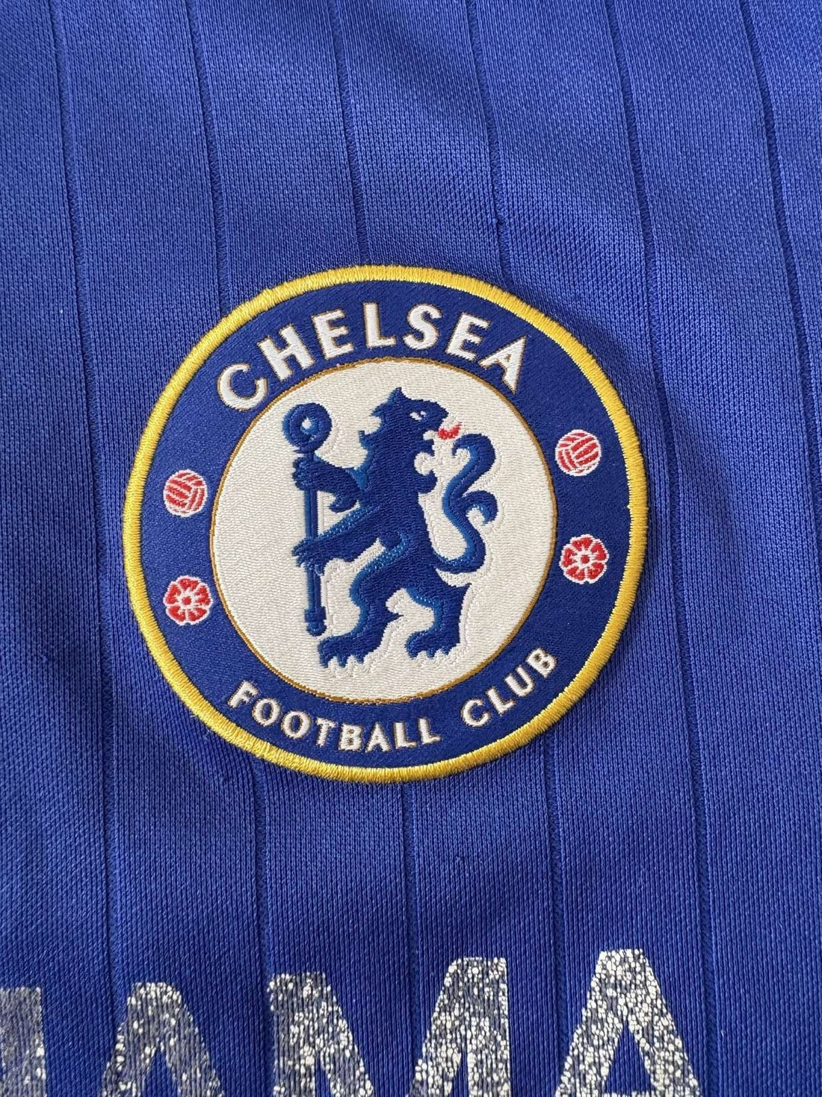 Chelsea club crest on the 2015/16 home shirt