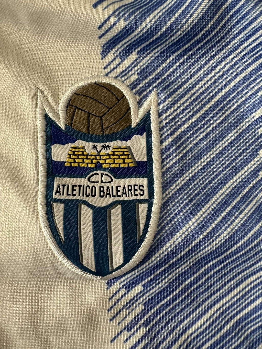 Atletico Baleares club crest on the 2018/19 home shirt