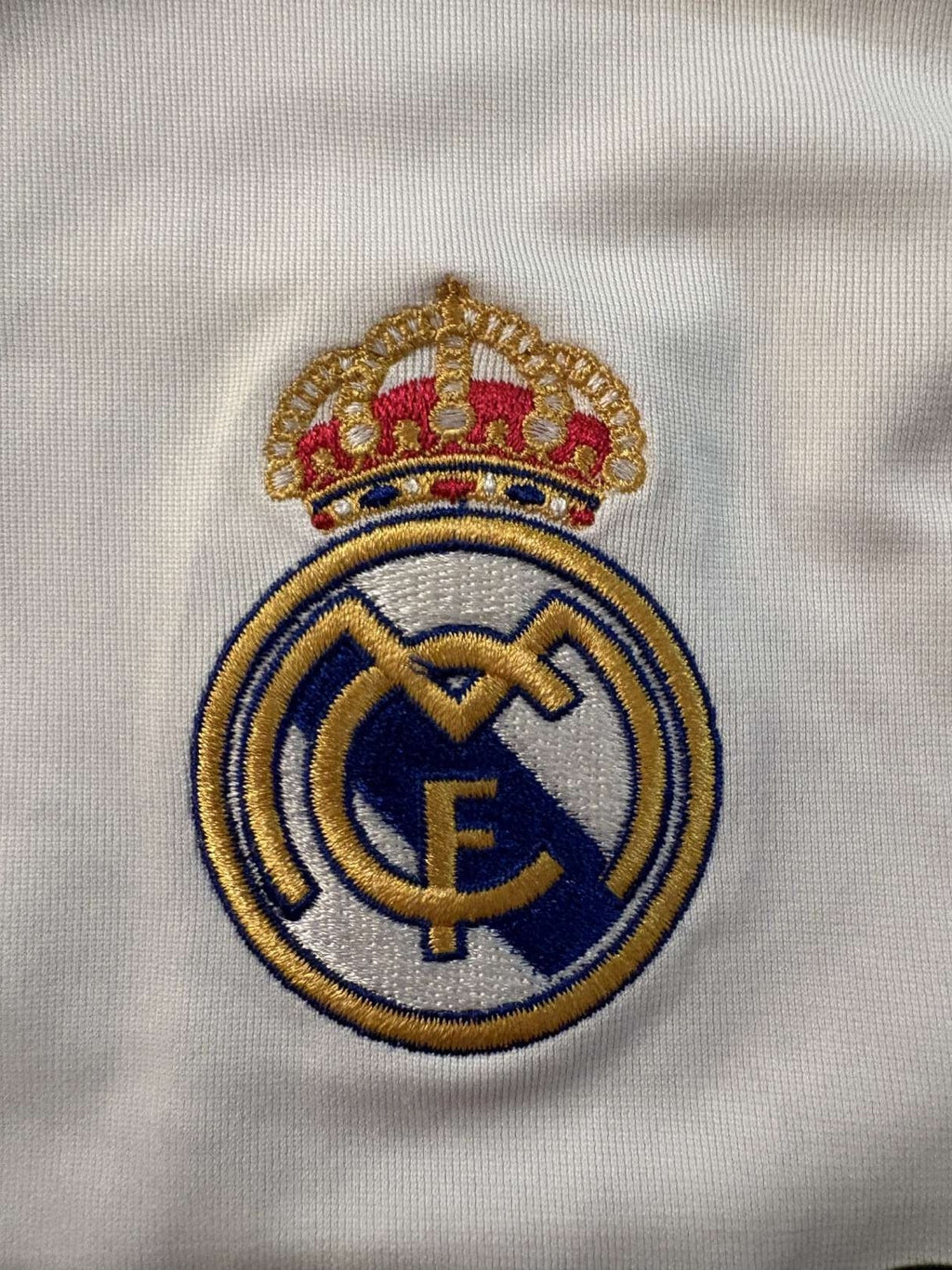 Real Madrid club crest on the 2005/06 home shirt