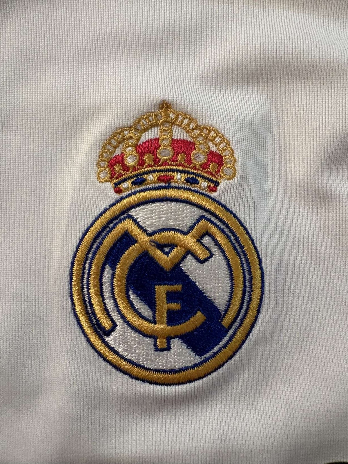 Real Madrid club crest on the 2005/06 home shirt