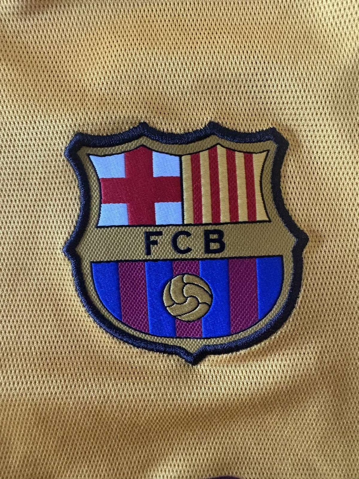 Barcelona club crest on the 2015/16 away shirt