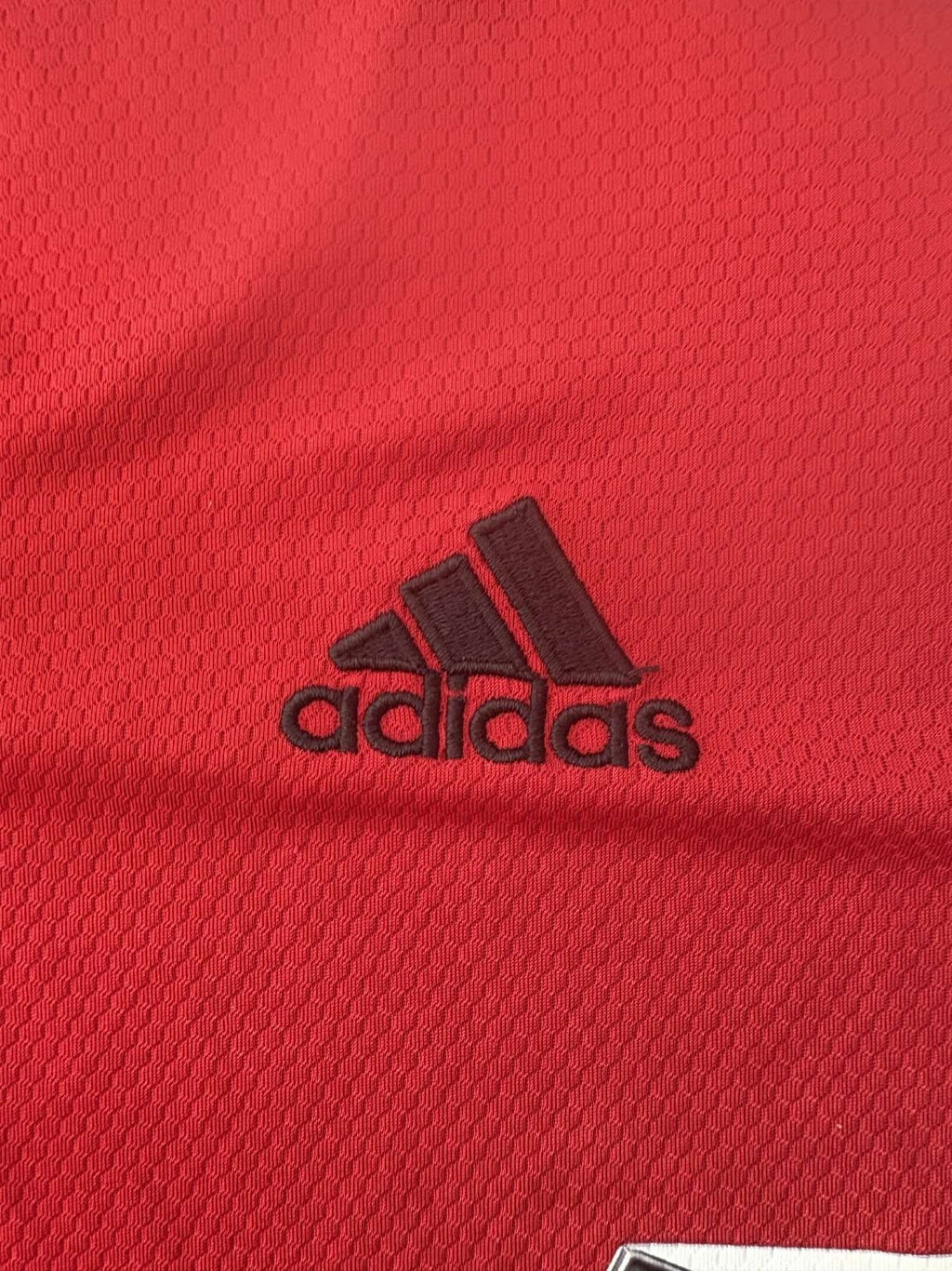 adidas branding on the Manchester United shirt