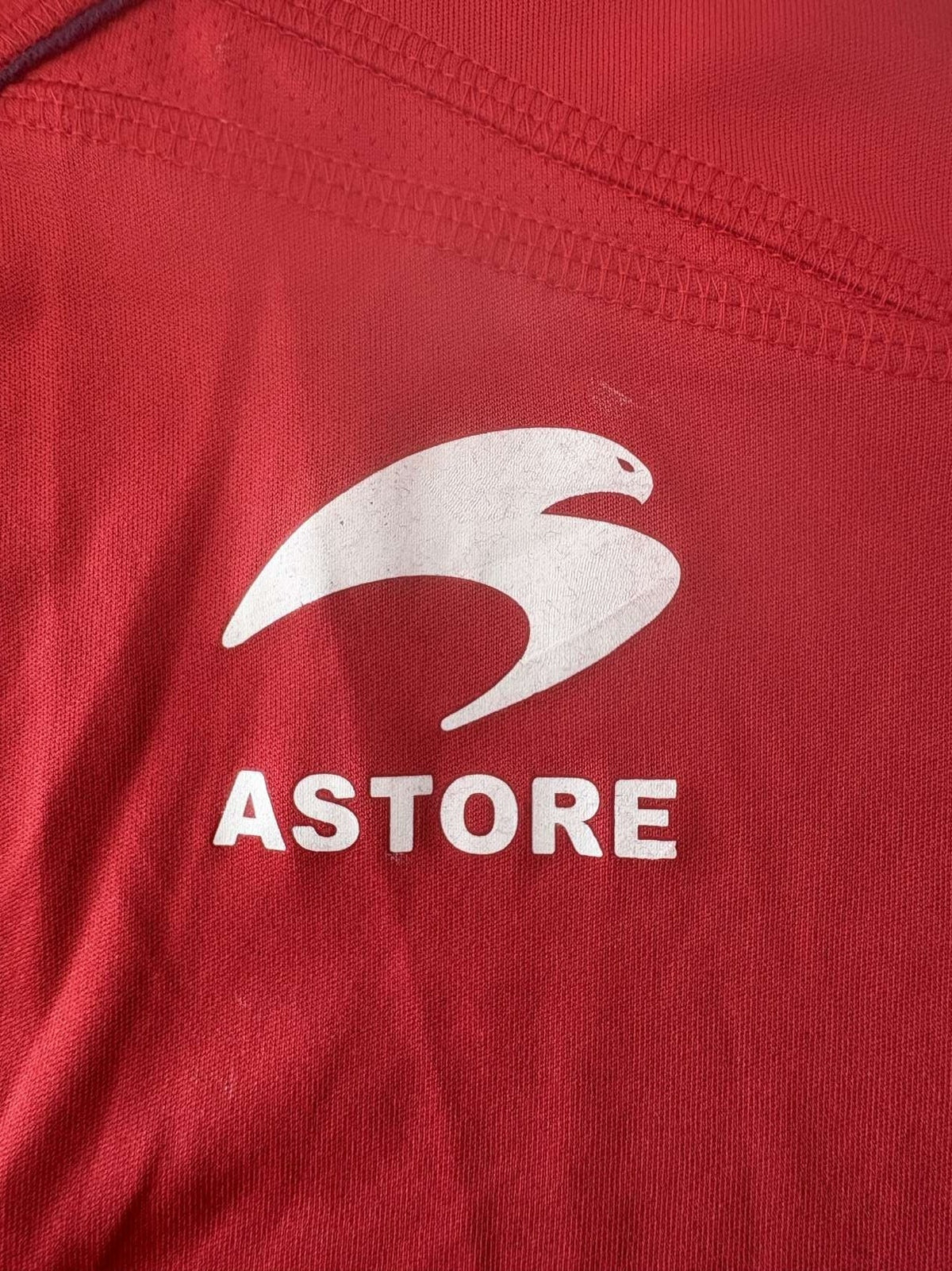 Astore branding on the Osasuna home shirt