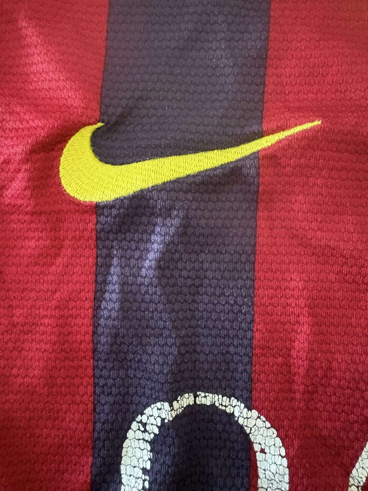 Nike branding on the 2013/14 Barcelona home shirt