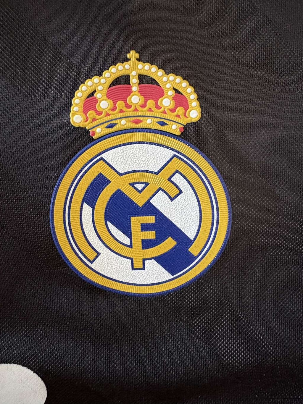 Real Madrid crest on the 2011/12 away shirt
