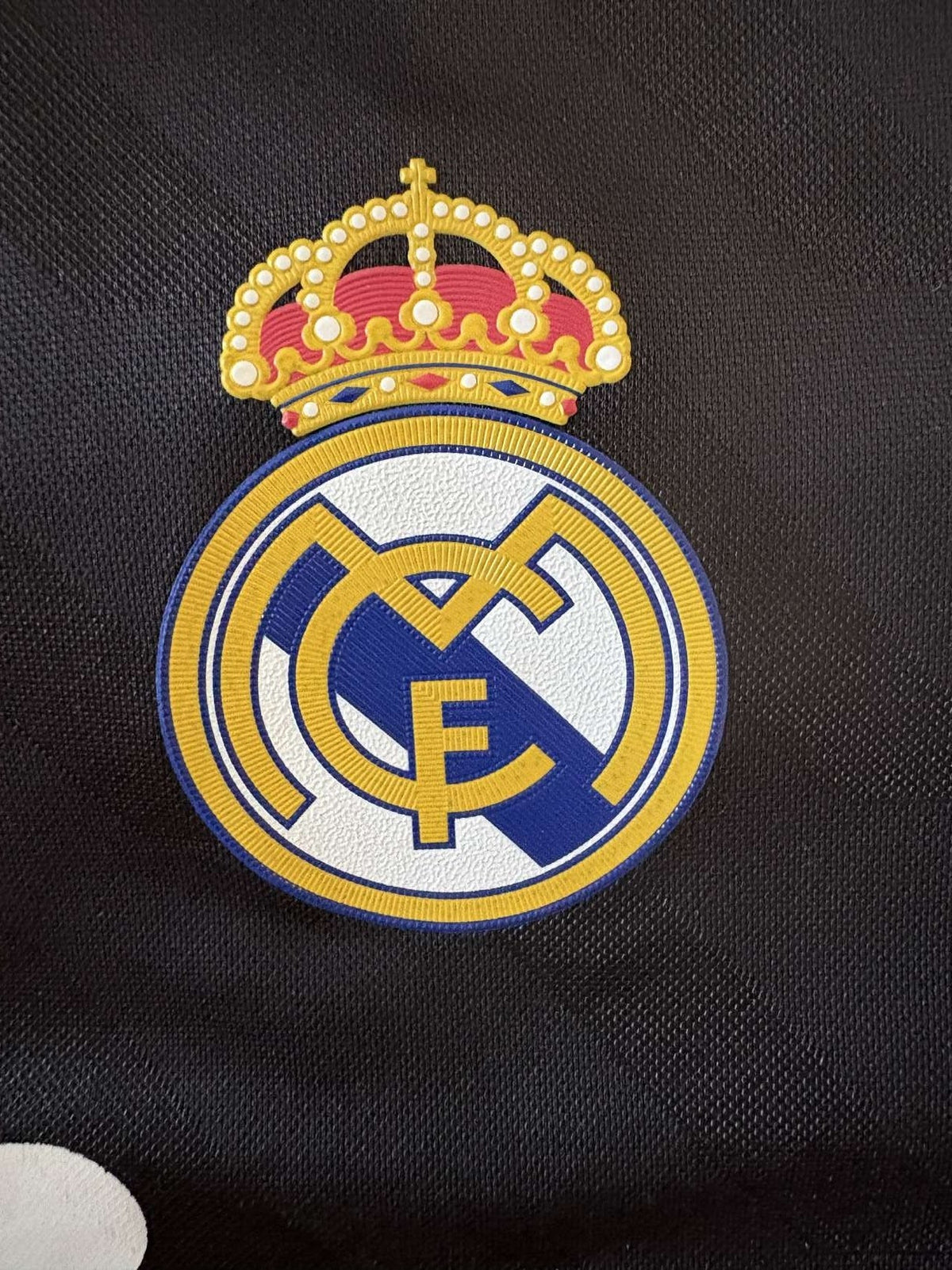 Real Madrid crest on the 2011/12 away shirt