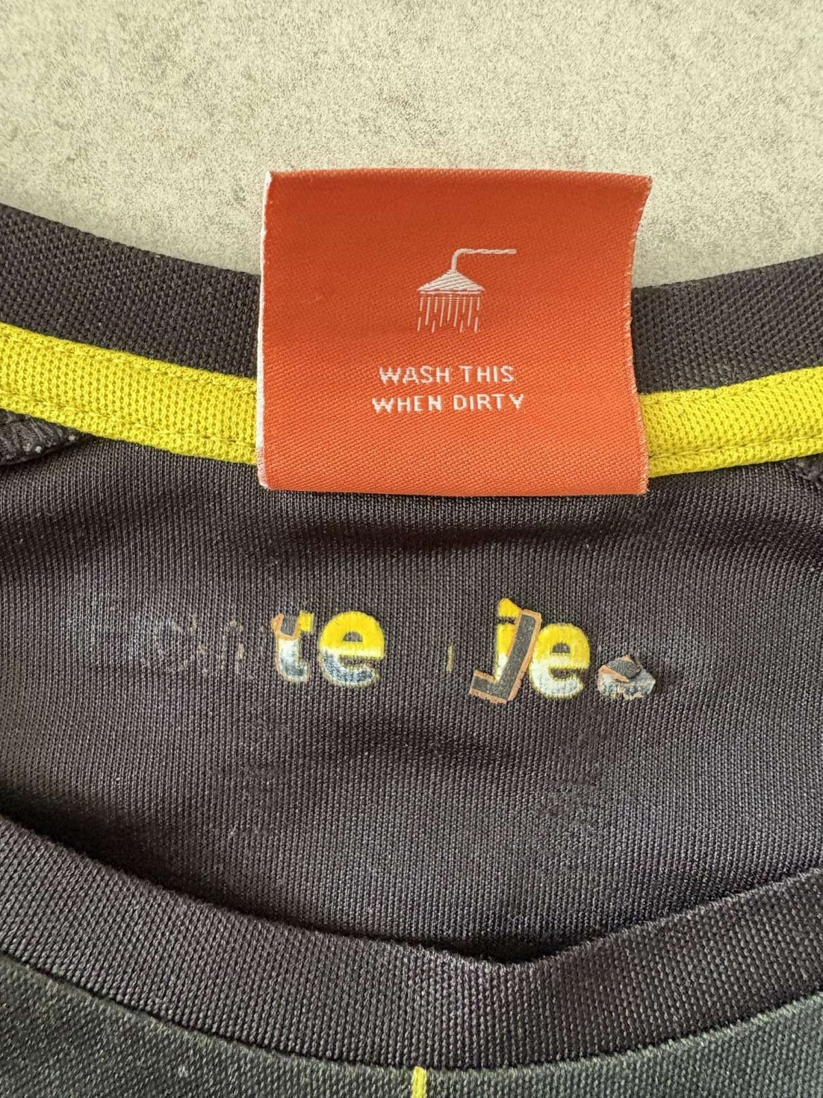 Neck logo detail on the 2014/15 Borussia Dortmund away shirt