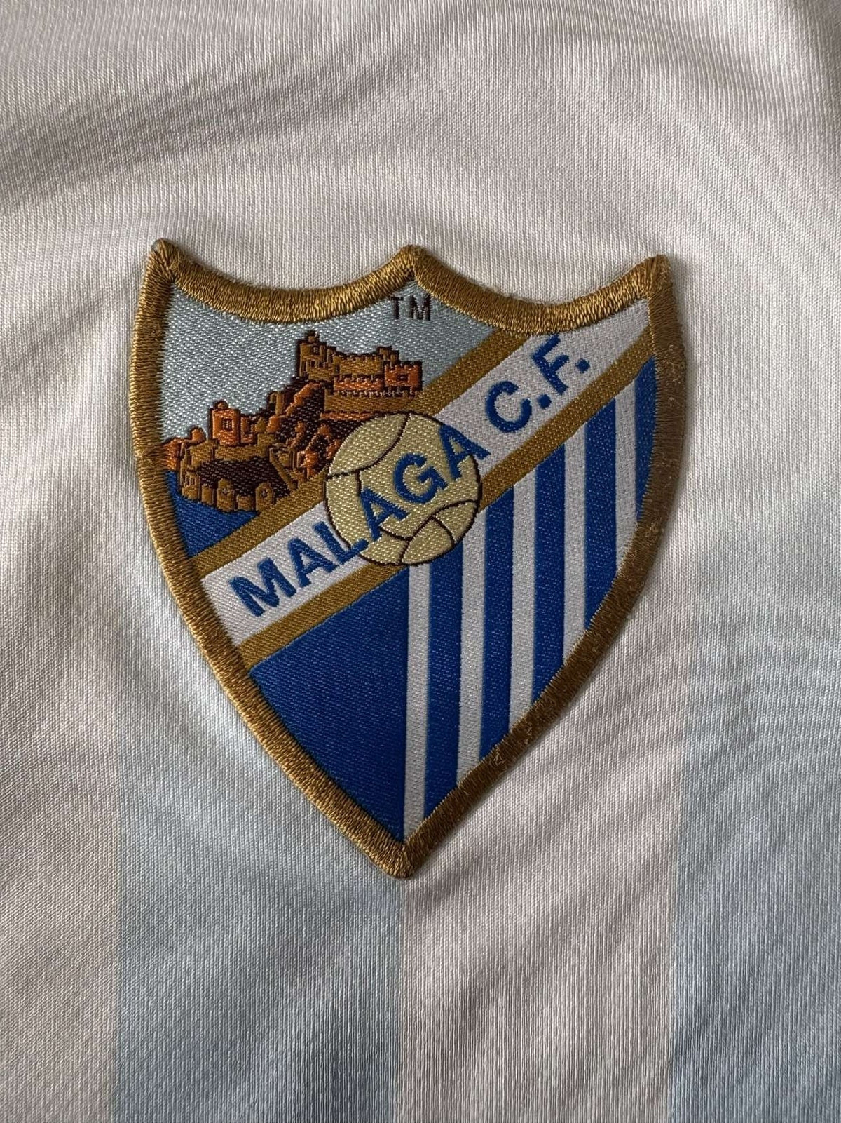 Malaga crest on the shirt