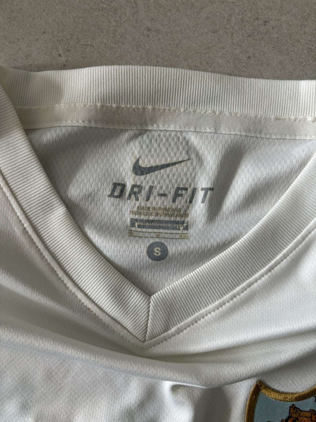 Collar detail of the Malaga home shirt