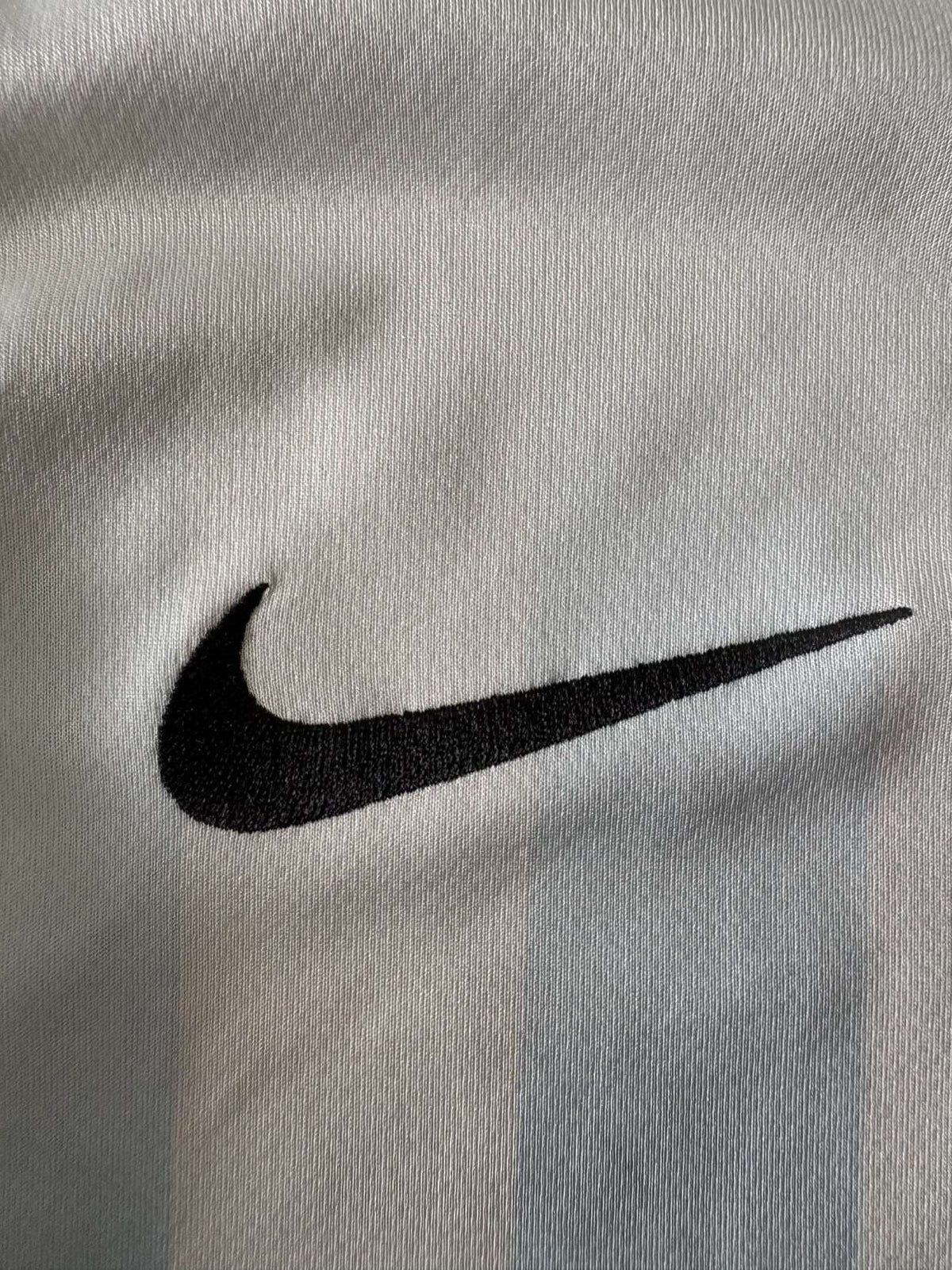 Nike branding on the Malaga home shirt