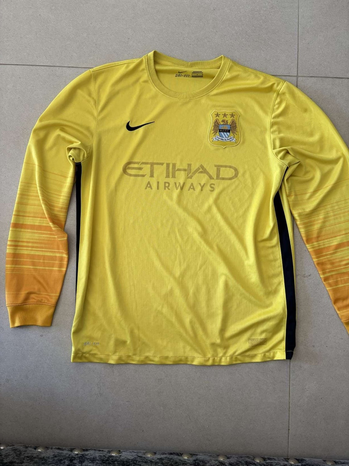 Manchester City goalkeeper shirt in yellow, front, Nike with Etihad Airways sponsor