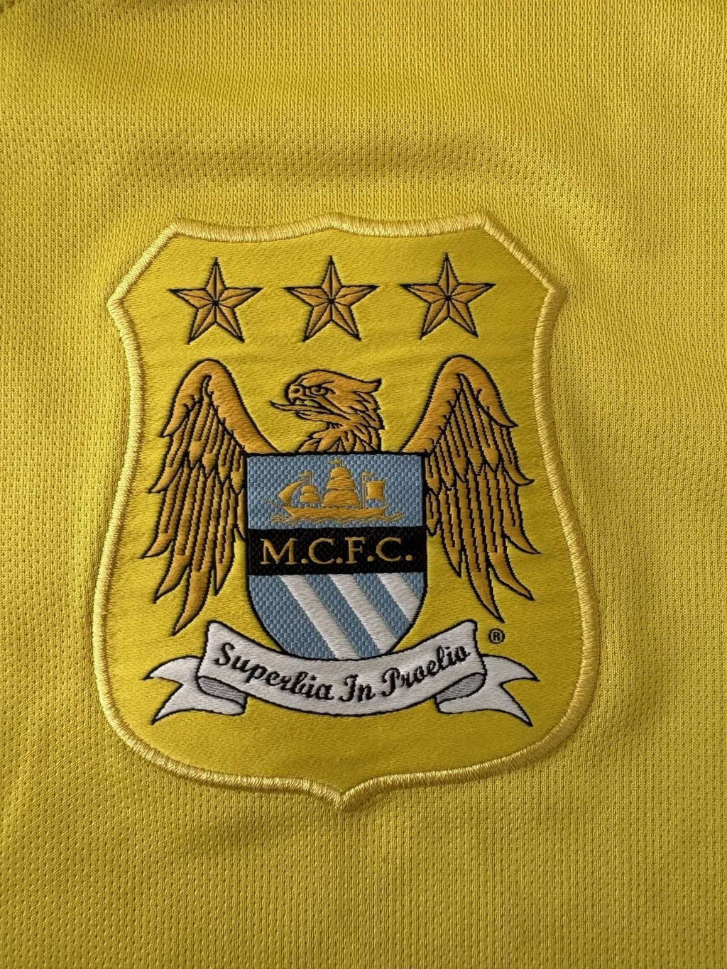Manchester City crest on the goalkeeper shirt